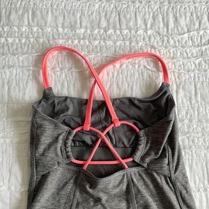 Lululemon tank top with pink strapped detail.